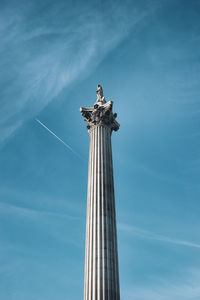 Low angle view of column against sky