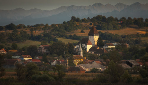 Moments before sunset with hosman village near sibiu and fagaras mountains in background.