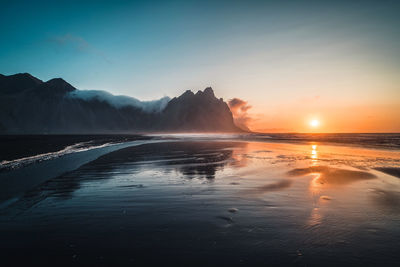 Scenic view of sea against sky during sunset