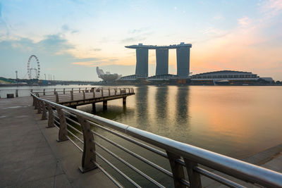 Marina bays sands hotel seen from pier during sunrise