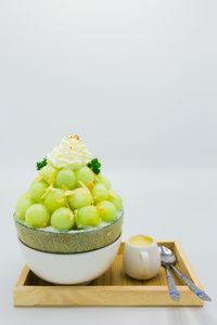 Close-up of vegetables in bowl against white background