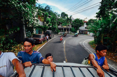 People on road in city