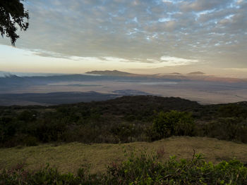 Scenic view of landscape against cloudy sky