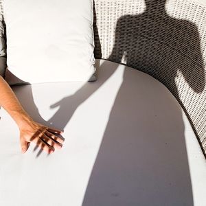 Cropped hand of man with girlfriend shadow on seat