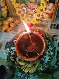 Close-up of lit tea light candles on table