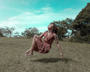 Full length of woman on field against sky