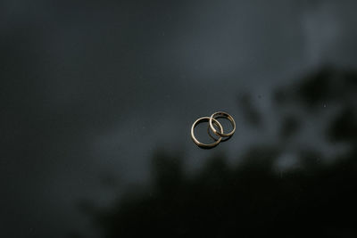 Close-up of wedding rings on metal