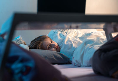 Boy sleeping on bed