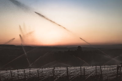 Scenic view of landscape against sky during sunset