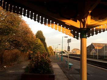 Illuminated street light against sky