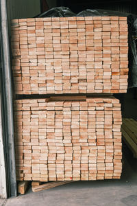 Stack of stone wall by building