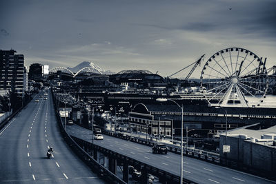 View of bridge over city against sky