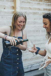 Female friends having champagne