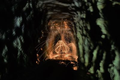 Close-up of illuminated lighting equipment on land at night