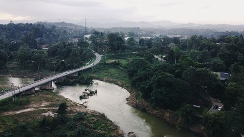 High angle view of road by city against sky