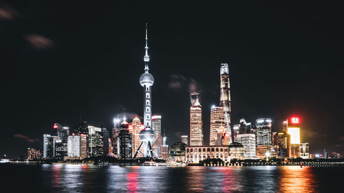 Illuminated buildings in city at night