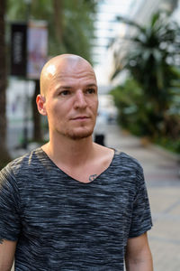 Portrait of young man standing outdoors