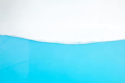 Close-up of ice cream over swimming pool