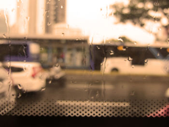 Close-up of wet glass window in rainy season