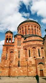 Low angle view of cathedral against cloudy sky