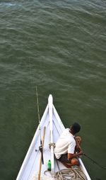 People sitting on boat in water