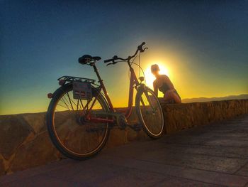 Silhouette of bicycle at sunset