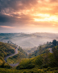 Scenic view of landscape against sky during sunset