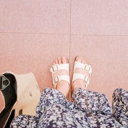 Low section of woman standing on tiled floor