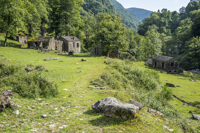 Ruined stone houses and mills in an abandoned mountain village in the alps