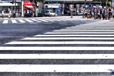 People walking on zebra crossing