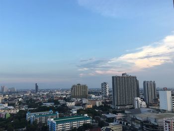 Modern buildings in city against sky