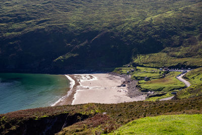 High angle view of land and sea against trees