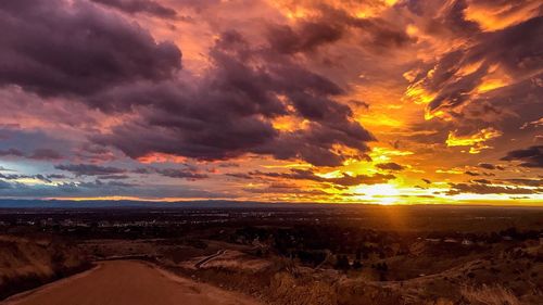 Scenic view of landscape against sky during sunset