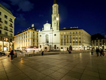 Buildings in city at night