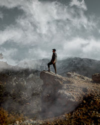 Man on rock in mountains