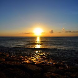 Scenic view of sea at sunset