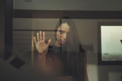 Woman standing by window