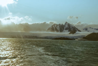 Scenic view of sea against sky during winter