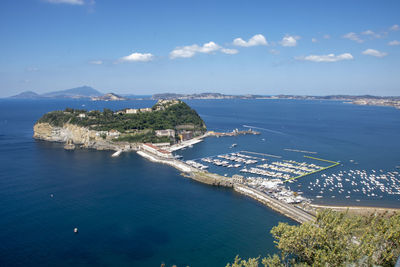 High angle view of sea and cityscape against sky