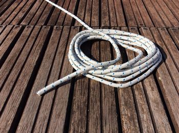 Close-up of rope tied on wood