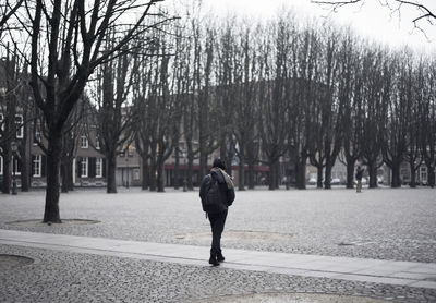 Rear view of woman in winter