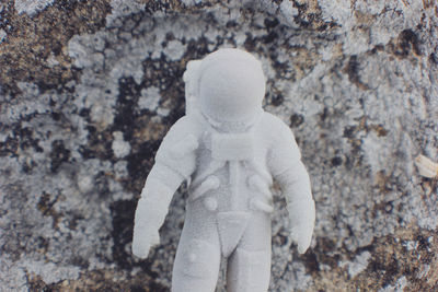Close-up of toy against rock