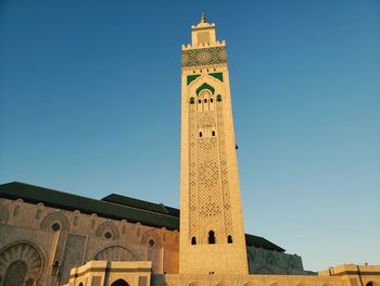 Low angle view of clock tower against sky