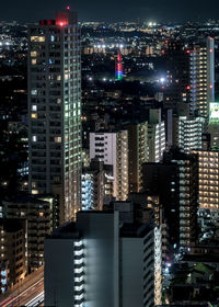 Illuminated buildings in city at night