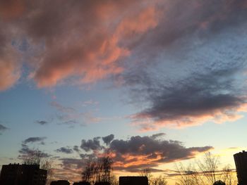 Low angle view of cloudy sky at sunset