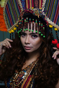 Portrait of beautiful young woman wearing headdress