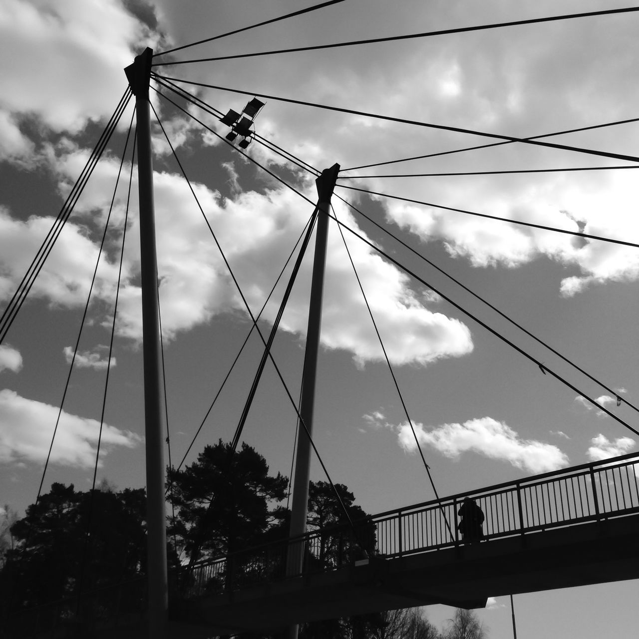 sky, low angle view, connection, cloud - sky, cloudy, bridge - man made structure, transportation, cloud, engineering, suspension bridge, built structure, cable, cable-stayed bridge, bridge, day, steel cable, outdoors, architecture, metal, silhouette