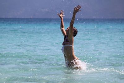 Man jumping in sea