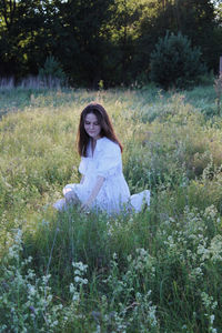 Woman sitting on a field