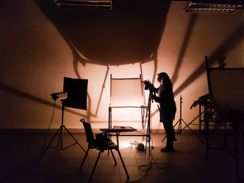 High angle view of man sitting on stage